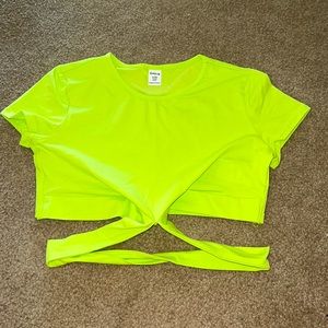 I am selling this neon yellow crop top that wraps around.